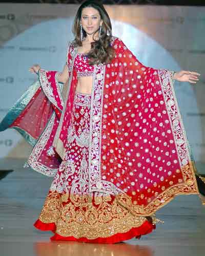 Karishma Kapoor donning a beautiful red Manish Malhotra lehenga