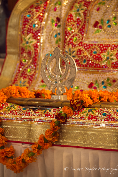 The Sikh Wedding Ceremony takes place in the holy presence of Guru Granth