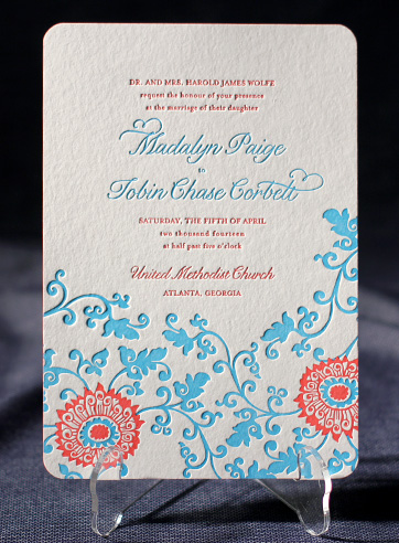 Monogram invites have initials of the couple designed cut and pasted on the 